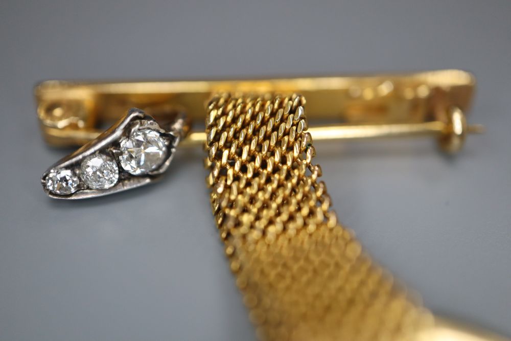 A 9ct gold lapel watch suspension and a three-stone graduated diamond set suspension, gross 7 grams.